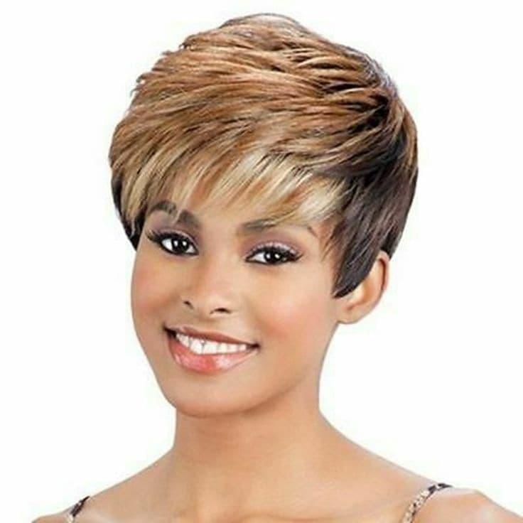 does reba mcentire wear wigs A closer look at Reba McEntire's hair evolution and stage styling